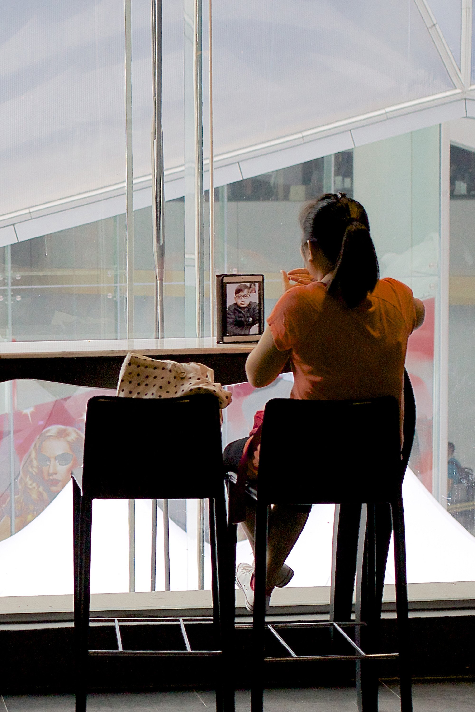 Woman talking to man on her mobile phone